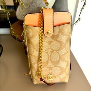 Coach North/South phone crossbody like new signature in coral peach